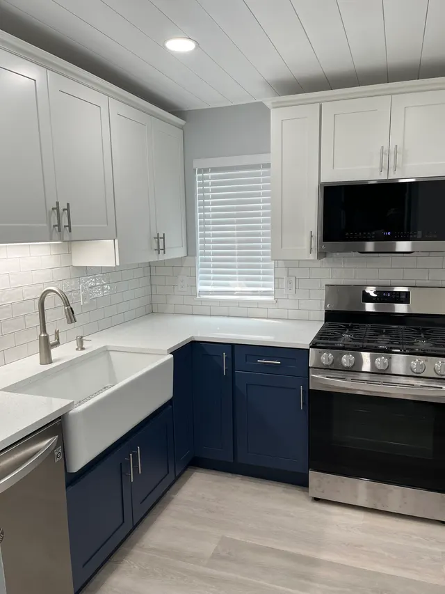 Blue shaker with white shaker — a kitchen supplied by Wow Cabinets