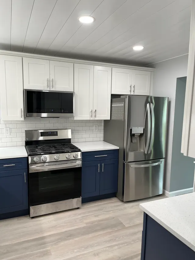 Blue shaker with white shaker — a kitchen supplied by Wow Cabinets